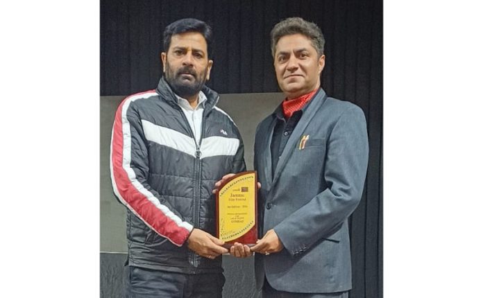 Lawyers Narinder Sharma and Umesh Sharma posing with their award in Jammu.