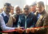 Deputy CM Surinder Choudhary flanked by PHE Minister Javed Rana inaugurating WSS at Sopore Fruit Mandi on Saturday.