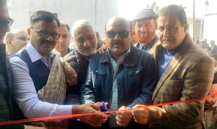 Deputy CM Surinder Choudhary flanked by PHE Minister Javed Rana inaugurating WSS at Sopore Fruit Mandi on Saturday.