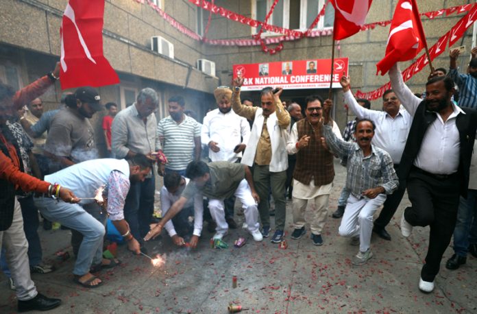 NC leaders and workers celebrating passing of resolution on special status to J&K at party office in Jammu. —Excelsior/Rakesh