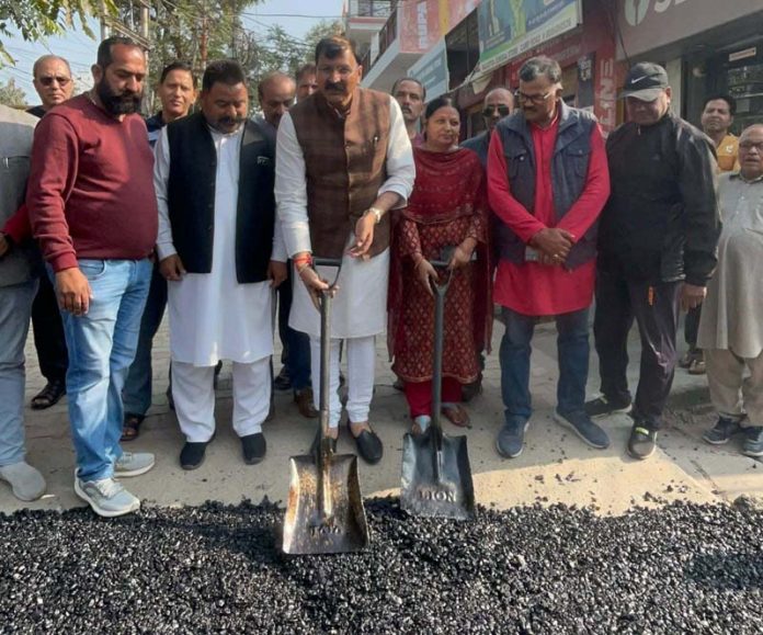 MLA Jammu West, Arvind Gupta kick-starting black topping of road in Amar Colony on Sunday.