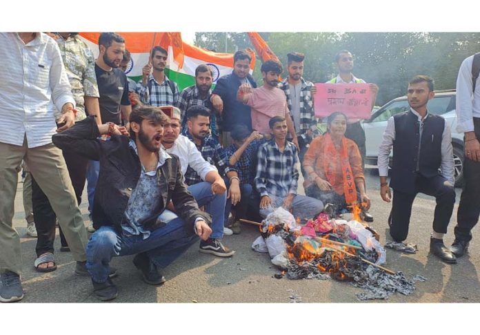 Members of ABVP protesting against NC Government outside Jammu University on Friday. (UNI)