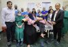 A team of doctors posing with Dr Yashpal Sharma (ED, SMVD Institute of Medical Excellence) after performing cochlear implant surgeries on two children.