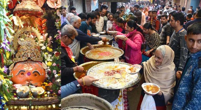 A huge rush of devotees having Prasad during annual Bhandara at ancient Bhairav Temple located at Chowk Chabutra, Jammu. -Excelsior/Rakesh