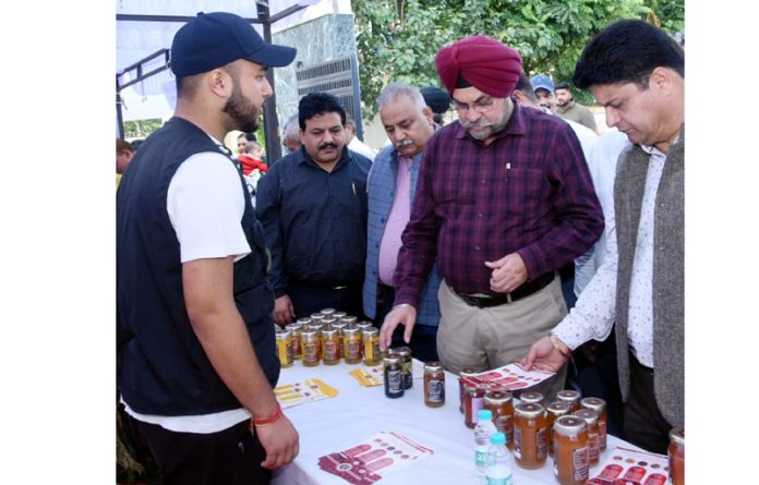 Director Agriculture inspecting stall during Honey Festival.