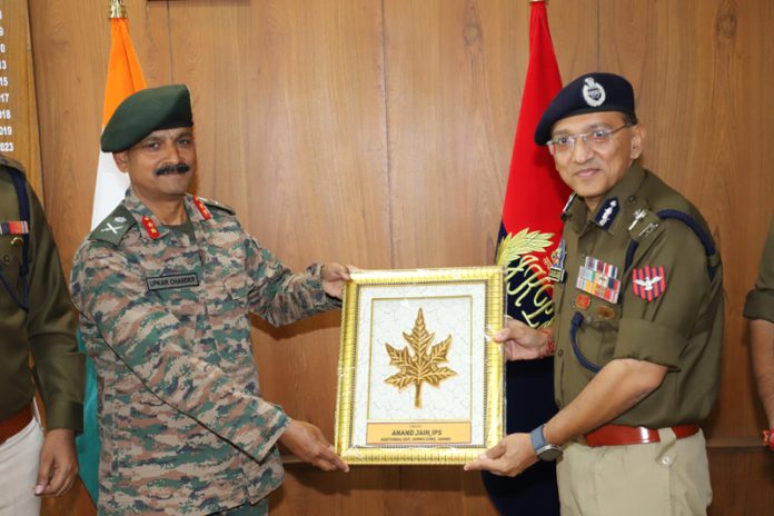 ADGP Anand Jain presenting a memento to outgoing GOC Delta Force, Major General Upkar Chander, in Jammu on Tuesday.