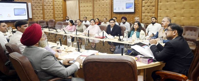 Minister Satish Sharma chairing a meeting on Wednesday.