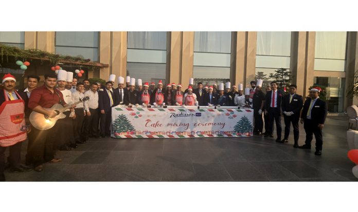 Chefs posing for a group photograph during a cake mixing ceremony at Radisson Blu Hotel on Thursday.