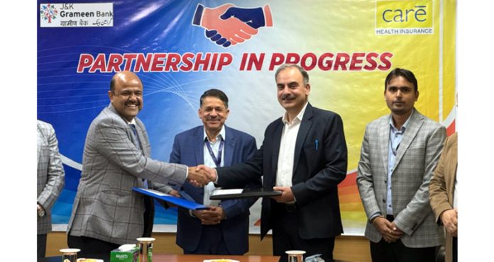 Sanjay Gupta, Chairman J&K Grameen Bank signing an agreement in Jammu on Thursday.