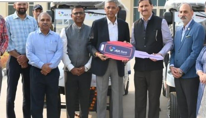 Sunit Kumar, GM (J&K Bank) handing over keys of e-vehicles to Director of IIM Jammu in Srinagar on Thursday.