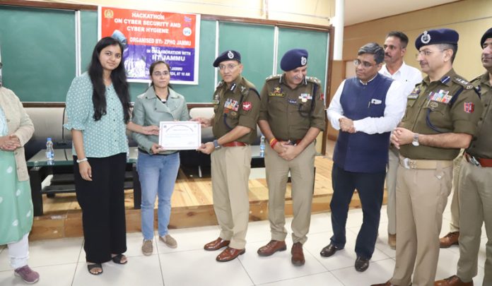 ADGP Jammu Anand Jain presenting a participant with a certificate during a hackathon event organised in Jammu on Thursday.