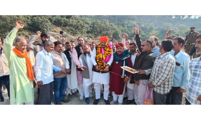 Surjeet Singh Slathia launching macadamizing work of road.