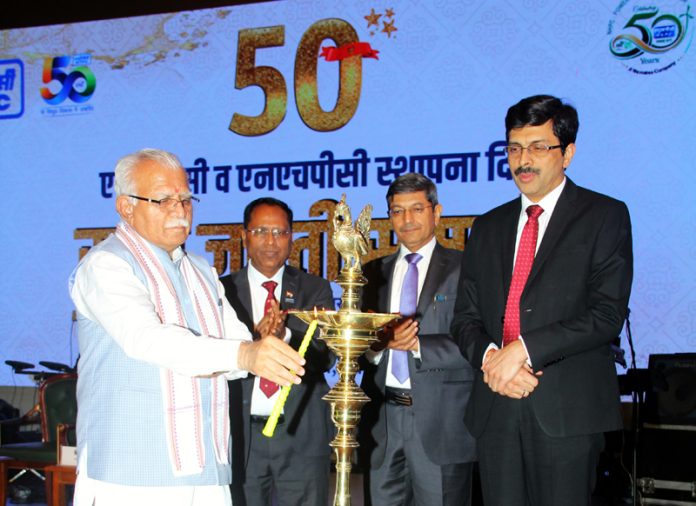 Manohar Lal, Union Minister lighting the traditional lamp during a function on Saturday.