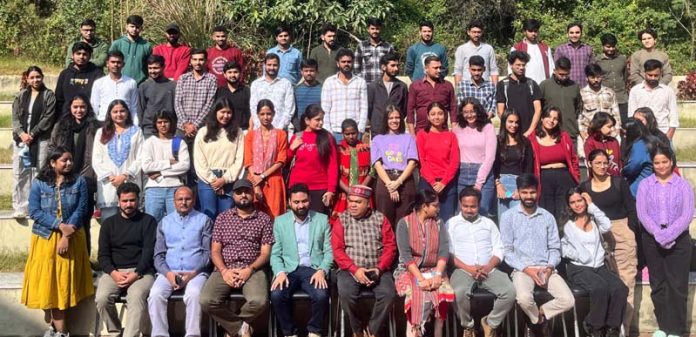 Varun Suthra with students and faculty members of IIMC Jammu.