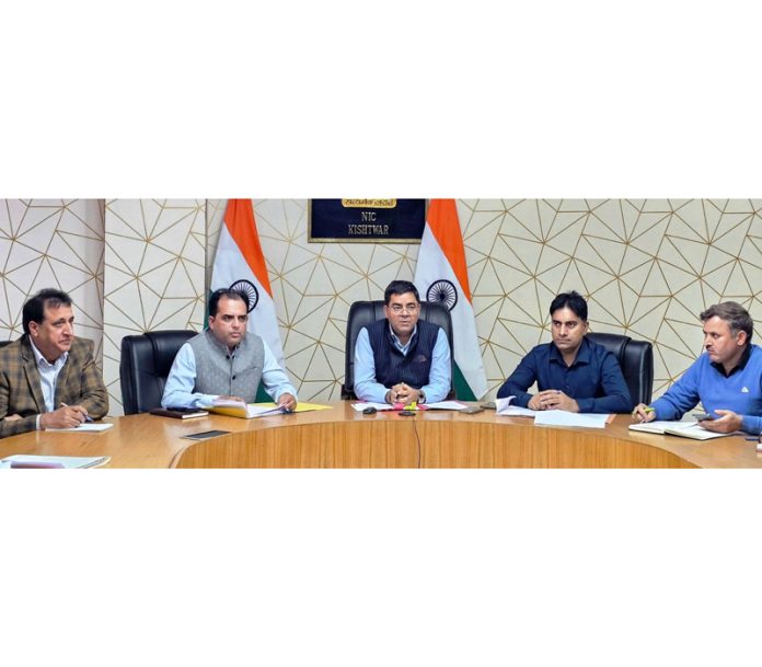 DC Kishtwar Rajesh Kumar Shavan chairing a meeting on Monday.