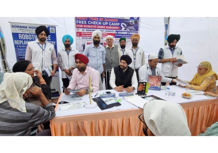 Doctors of Sohana Hospital Mohali providing free consultation to patients during a Robotic Surgery camp in Jammu.