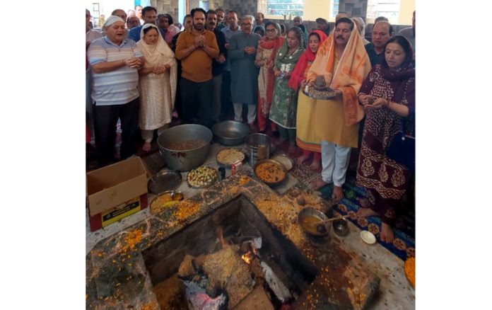 Devotees during performance of Puranahuti of Maha Yagya at Swami Atma Ram Vedanta Ashram, Tomal Bohri on Tuesday.