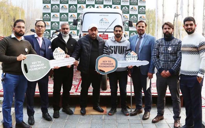 Officials of Khyber Cement presenting keys of vehicles to the winners in Srinagar on Wednesday.