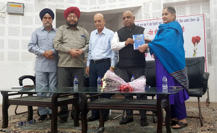 Dignitaries during a seminar on life and legacy of Guru Nanak Dev Ji at Jammu on Tuesday. -Excelsior /Rakesh