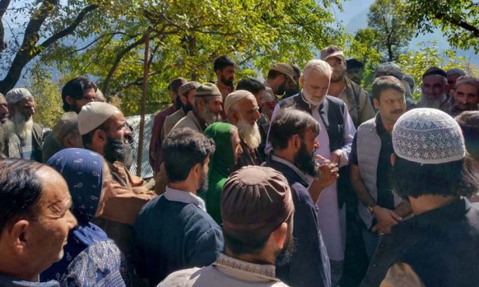 Former Minister, G.M Saroori interacting with locals during visit at Kuchal village in Kishtwar on Thursday.