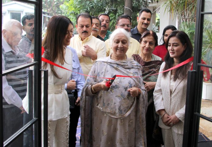 Tanisha Puri's grandmother Rama Puri inaugurating her (Tanisha's) fashion studio at Nanak Nagar, Jammu. —Excelsior/Rakesh