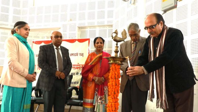 Guests lighting ceremonial lamp during inaugural of two-day Hindi conference on Wednesday.