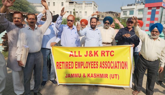 Retired JKRTC employees staging protest in Jammu on Tuesday. -Excelsior/ Rakesh