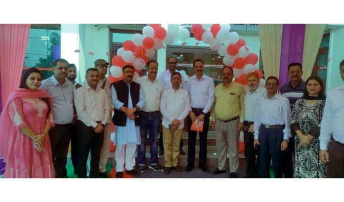 MLA Dr Bharat Bhushan posing along with others after inaugurating branch of CSF Bank in Kathua.