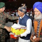 General-Officer-Commanding White Knight Corps Lieutenant General Navin Sachdeva interacting with Army Veterans on Poonch Day on Friday. (UNI)