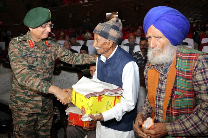 General-Officer-Commanding White Knight Corps Lieutenant General Navin Sachdeva interacting with Army Veterans on Poonch Day on Friday. (UNI)