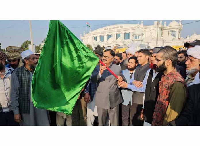 Minister Javed Rana flagging off tribal students for exposure tour.