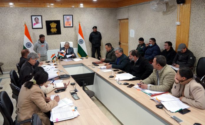 LG BD Mishra chairing a meeting in Leh on Friday.