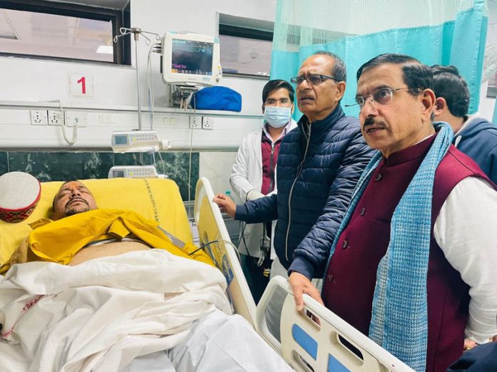 Union Ministers Shivraj Chouhan and Pralhad Joshi visit BJP MP Mukesh Rajput admitted at the RML Hospital after he got injured in clashes between India bloc and NDA MPs at Parliament complex in New Delhi on Thursday. (UNI)