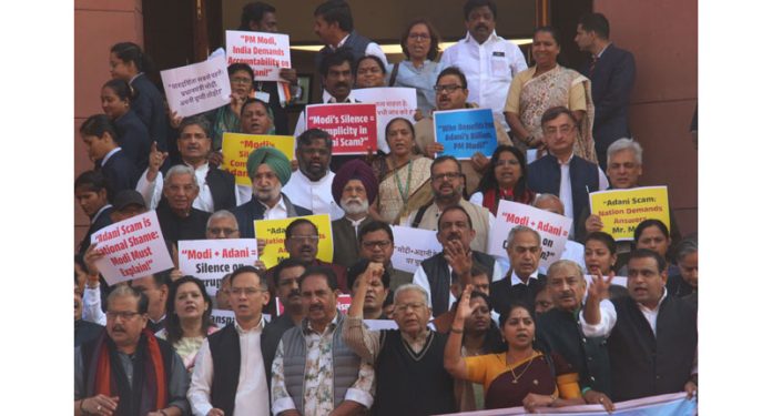 Opposition MPs stage protest over Adani issue outside the Parliament House in New Delhi on Wednesday. (UNI)