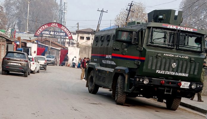 Security forces stationed outside Central Jail during raid conducted by SIA and CIK in Srinagar on Wednesday. -Excelsior/Shakeel