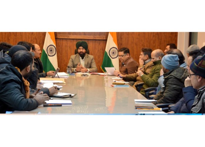 DDC Doda Harvinder Singh chairing a meeting on Tuesday. -Excelsior/Tilak Raj