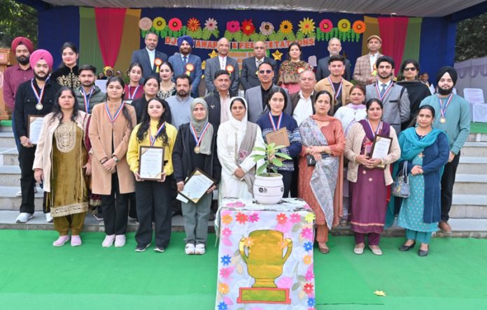 Students and others posing during Shining Stars and Silver Spirits Award Ceremony organized by DJSES at Jammu on Saturday.