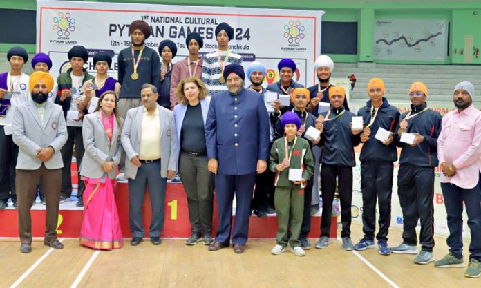 Dignitaries posing for a photograph with the medal-winning players at the Tau Devi Lal Stadium, Panchkula, Haryana.