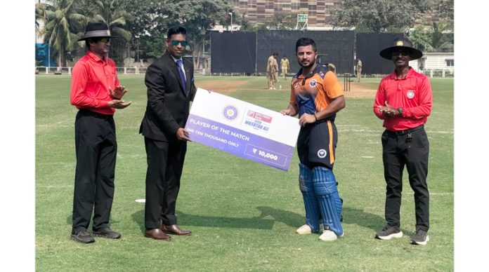 Shubham Khajuria receiving a cheque for man of the match.