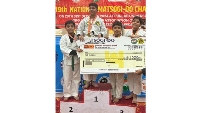 Namit Malhotra posing along with fellow winners on the podium during prize distribution ceremony at 19th National Matsogi-Do Championship in Chandigarh.