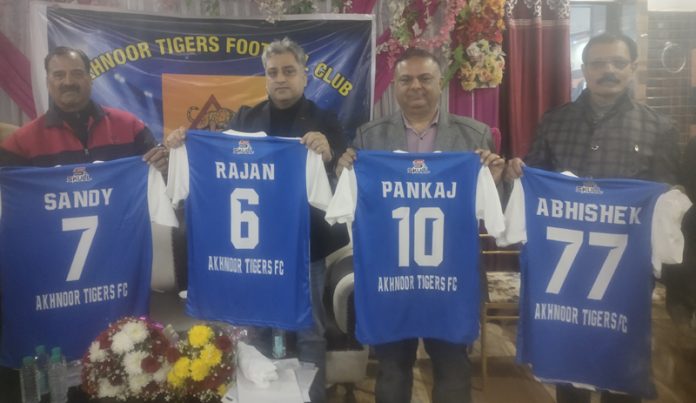 Akhnoor Tigers Football Club members posing along with jersey.