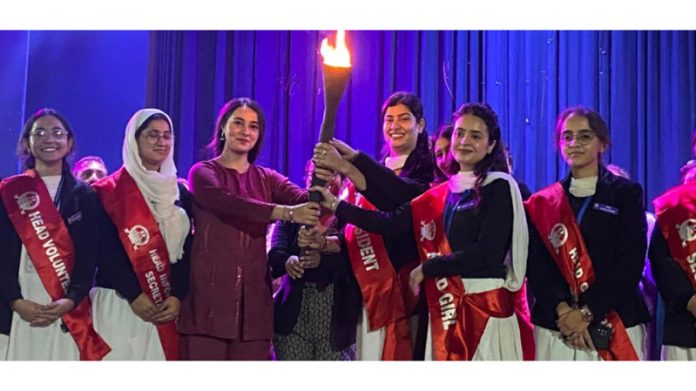 Newly elected students council posing along with torch at Jammu.