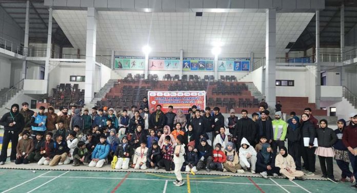 Taekwondo players posing along with dignitaries during closing ceremony at Handwara.