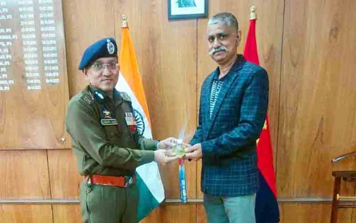 ADGP, Jammu Zone, Anand Jain posing along with Roller Hockey player.