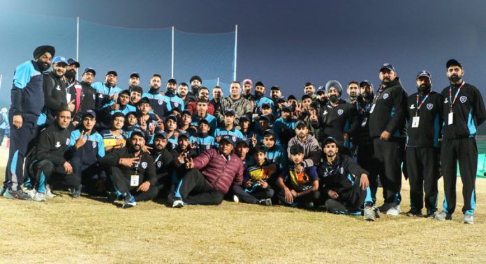 J&K Softball team posing for group photograph.