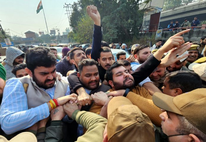 Youth Cong activists taking out protest march in Jammu. -Excelsior/Rakesh