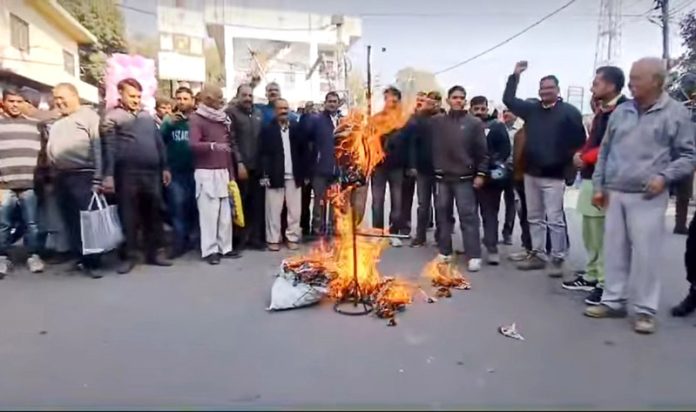 Villagers torch effigy during protest against no supply of drinking water.