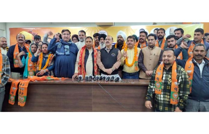 Prominent people including former Government officers and social and political activists being taken into party fold by BJP J&K UT president, Sat Sharma at Jammu on Monday