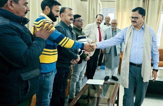 Minister Javed Ahmad Rana meeting a delegation at Jammu on Monday.