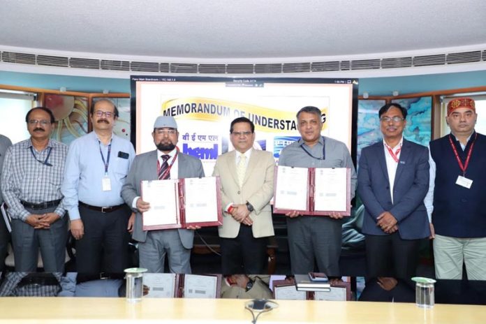 Officials of NHPC and BEML showing the copies of MoU signed on Monday.